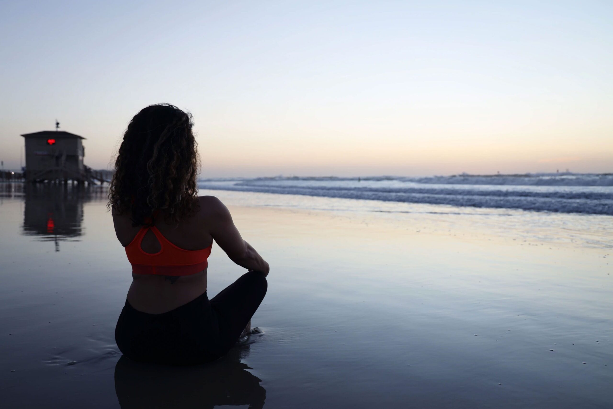 Woman Sitting on the Beach Woman Sitting on the Beach