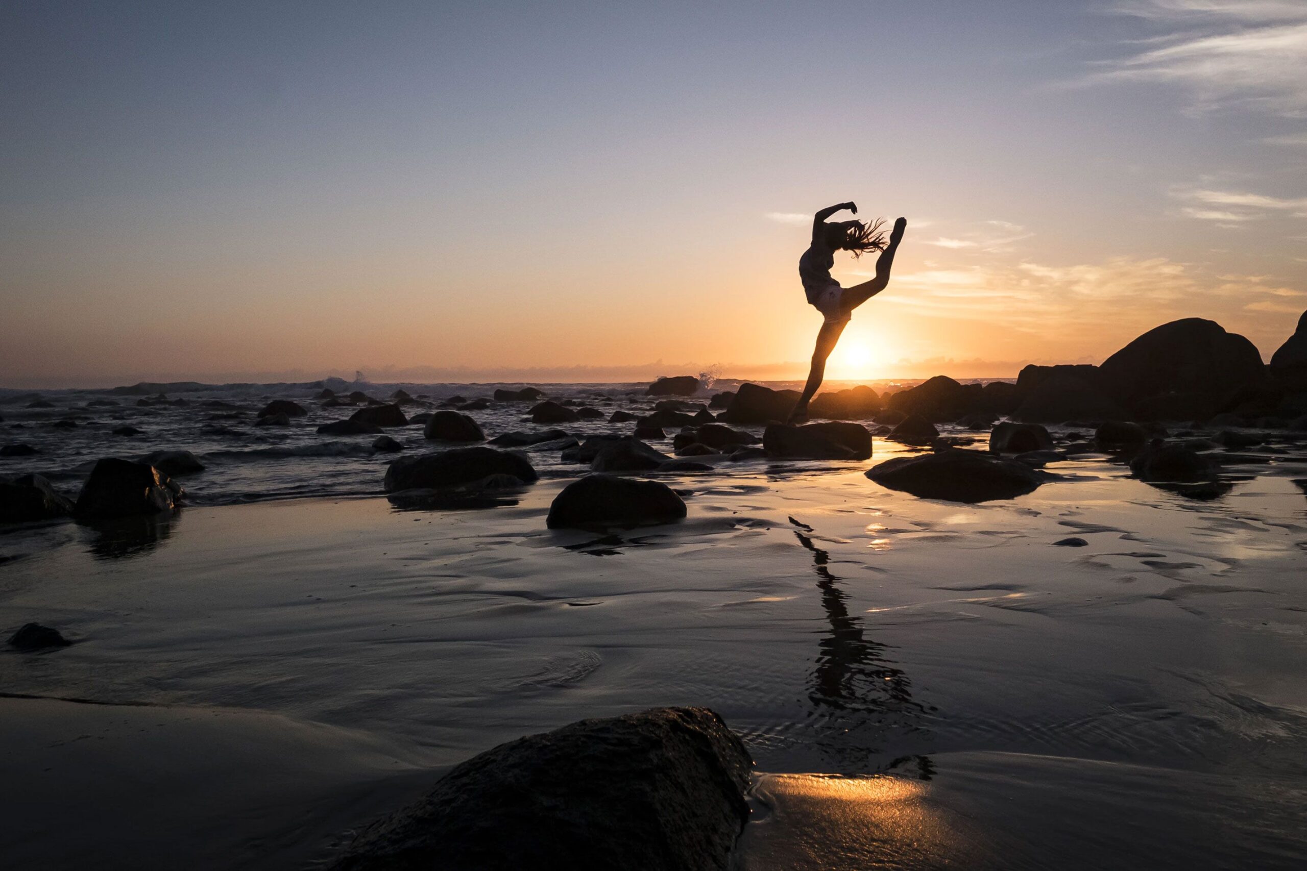 Woman Doing Yoga at the Beach Woman doing Yoga at the Beach